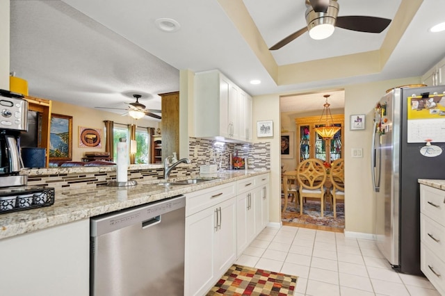9018 39th Ln N Unit 5, Pinellas Park, FL 33782 - kitchen featuring stainless steel appliances, ceiling fan, a sink, tasteful backsplash, and recessed lighting