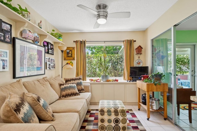 9018 39th Ln N Unit 5, Pinellas Park, FL 33782 - sitting room featuring a textured ceiling, a ceiling fan, and tile patterned flooring