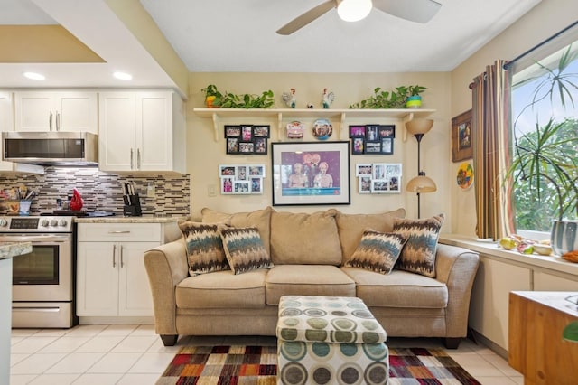9018 39th Ln N Unit 5, Pinellas Park, FL 33782 - living area with plenty of natural light, light tile patterned flooring, a ceiling fan, and recessed lighting