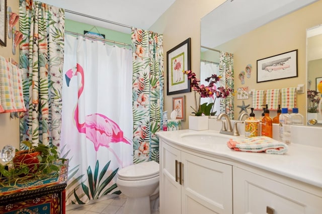 9018 39th Ln N Unit 5, Pinellas Park, FL 33782 - bathroom with toilet, tile patterned flooring, vanity, and a shower with curtain