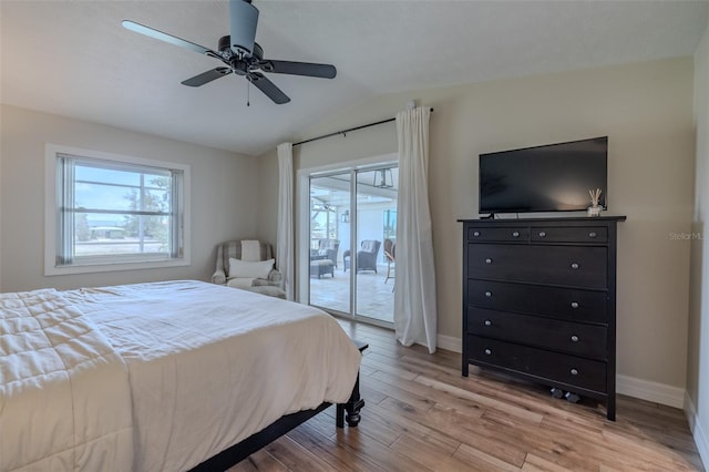 bedroom featuring access to outside, lofted ceiling, light wood-type flooring, baseboards, and a ceiling fan