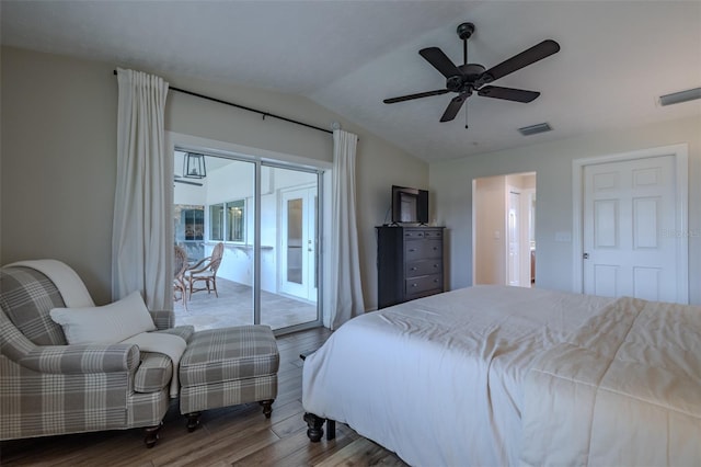bedroom featuring access to exterior, wood finished floors, lofted ceiling, and a ceiling fan
