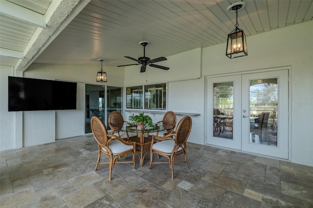 sunroom / solarium featuring french doors