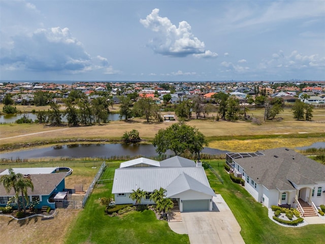 aerial perspective of suburban area with a nearby body of water
