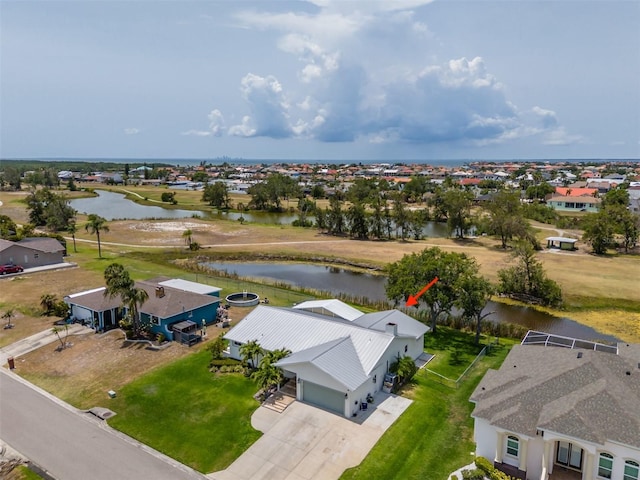 aerial view of residential area with a nearby body of water