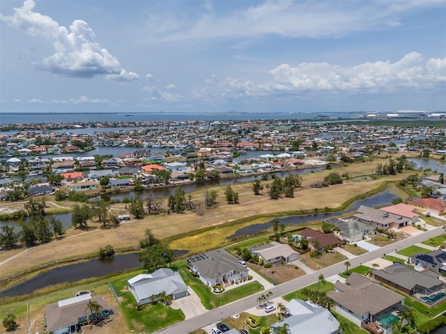aerial view of residential area with a nearby body of water