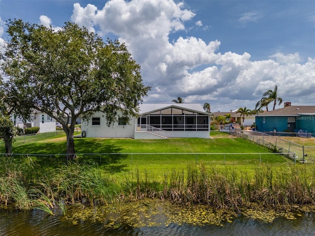 rear view of property featuring a water view