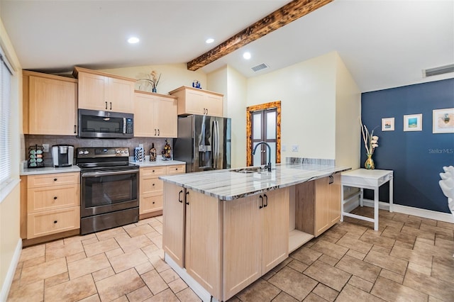 1041 Forest Grove Blvd, Palm Harbor, FL 34683 - kitchen featuring stainless steel appliances, a sink, light brown cabinetry, decorative backsplash, and a peninsula