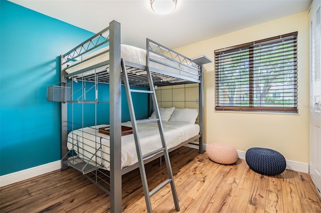 1041 Forest Grove Blvd, Palm Harbor, FL 34683 - bedroom with baseboards and hardwood / wood-style floors