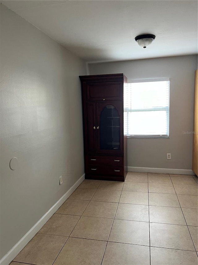7210 N Manhattan Ave Unit 1311, Tampa, FL 33614 - unfurnished room featuring light tile patterned floors and baseboards