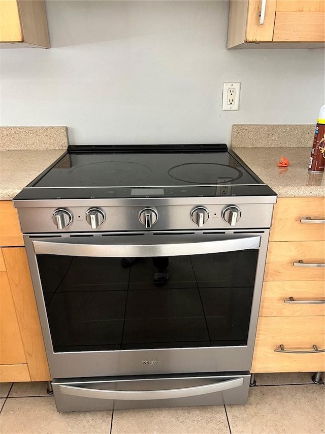 7210 N Manhattan Ave Unit 1311, Tampa, FL 33614 - kitchen view of stainless steel electric stove and light countertops