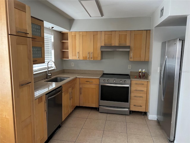 7210 N Manhattan Ave Unit 1311, Tampa, FL 33614 - kitchen with stainless steel appliances, a sink, light countertops, under cabinet range hood, and light tile patterned flooring