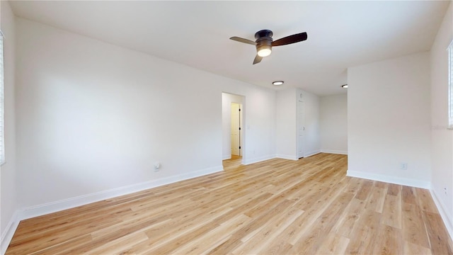 6710 S Juanita St, Tampa, FL 33616 - spare room with ceiling fan, light wood-style flooring, and baseboards