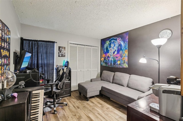 office featuring a textured ceiling and wood finished floors