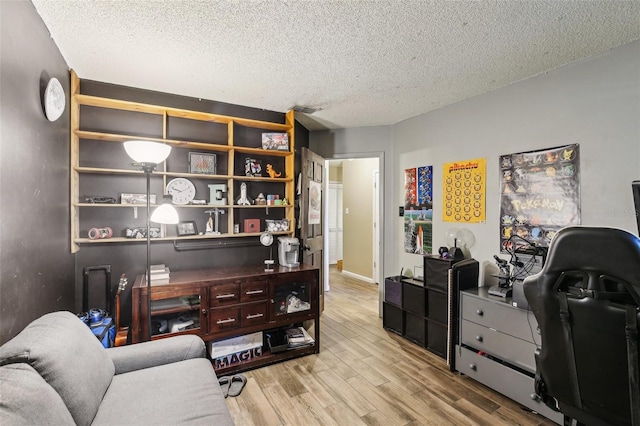 office space with wood finished floors and a textured ceiling