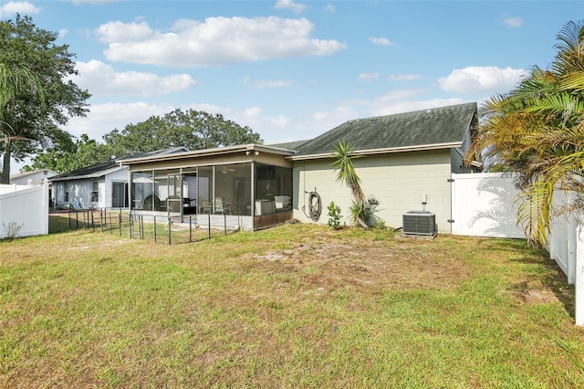 back of house featuring a sunroom and central air condition unit
