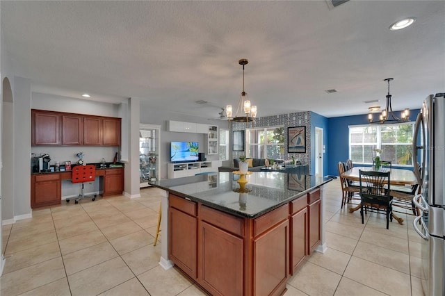 5914 Goldenbark Pl, Lithia, FL 33547 - kitchen featuring a chandelier, freestanding refrigerator, light tile patterned flooring, a kitchen island, and recessed lighting