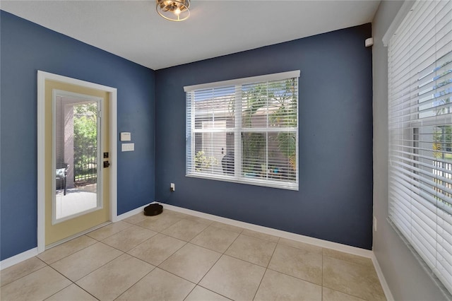 5914 Goldenbark Pl, Lithia, FL 33547 - entryway with light tile patterned floors and baseboards