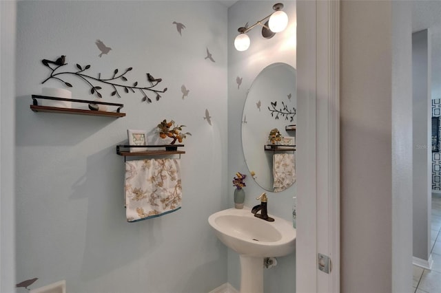 5914 Goldenbark Pl, Lithia, FL 33547 - bathroom featuring a sink and tile patterned floors