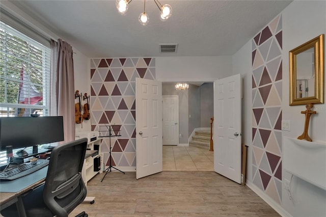 5914 Goldenbark Pl, Lithia, FL 33547 - office area with a chandelier, an accent wall, light wood-type flooring, baseboards, and wallpapered walls