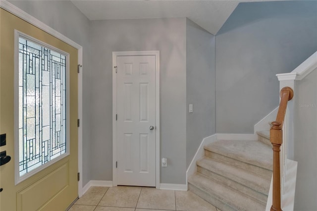 5914 Goldenbark Pl, Lithia, FL 33547 - entrance foyer featuring stairway, baseboards, and light tile patterned floors