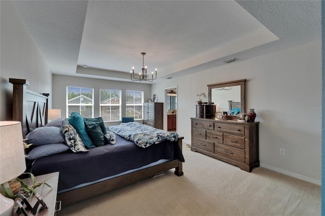 5914 Goldenbark Pl, Lithia, FL 33547 - bedroom featuring a raised ceiling, a chandelier, light carpet, baseboards, and a textured ceiling