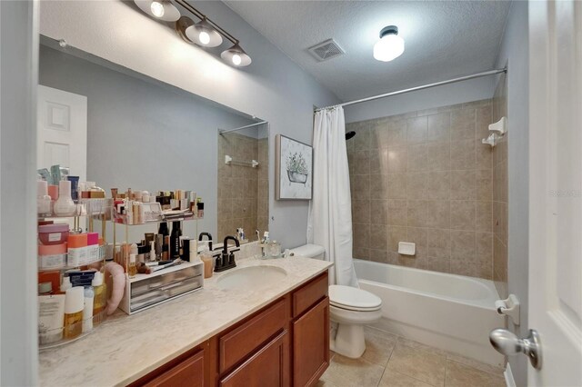5914 Goldenbark Pl, Lithia, FL 33547 - full bath with tile patterned flooring, shower / bath combo, vanity, toilet, and a textured ceiling