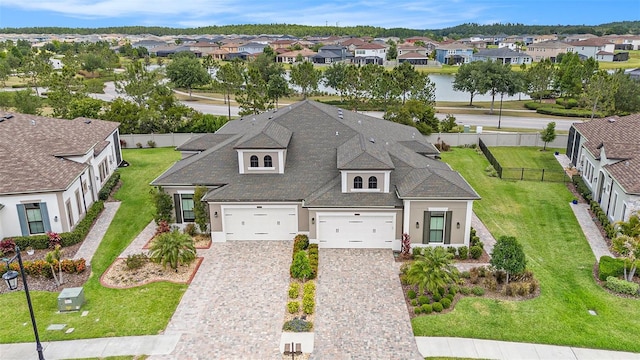 4329 Barletta Ct, Wesley Chapel, FL 33543 - view of front of property featuring a residential view, stucco siding, decorative driveway, and an attached garage