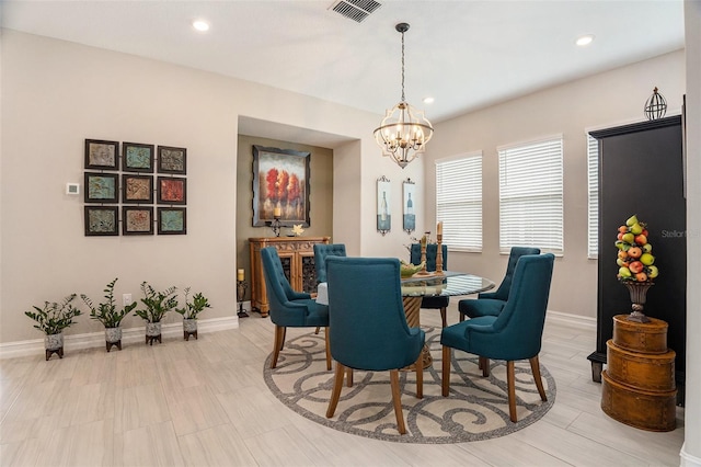 4329 Barletta Ct, Wesley Chapel, FL 33543 - dining area featuring a chandelier, baseboards, and recessed lighting