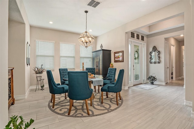 4329 Barletta Ct, Wesley Chapel, FL 33543 - dining area with a chandelier, baseboards, recessed lighting, and light wood-style floors