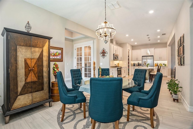 4329 Barletta Ct, Wesley Chapel, FL 33543 - dining room featuring a chandelier, baseboards, recessed lighting, and french doors