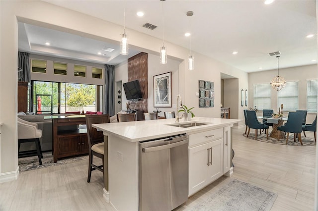 4329 Barletta Ct, Wesley Chapel, FL 33543 - kitchen featuring dishwasher, light countertops, a sink, white cabinets, and recessed lighting