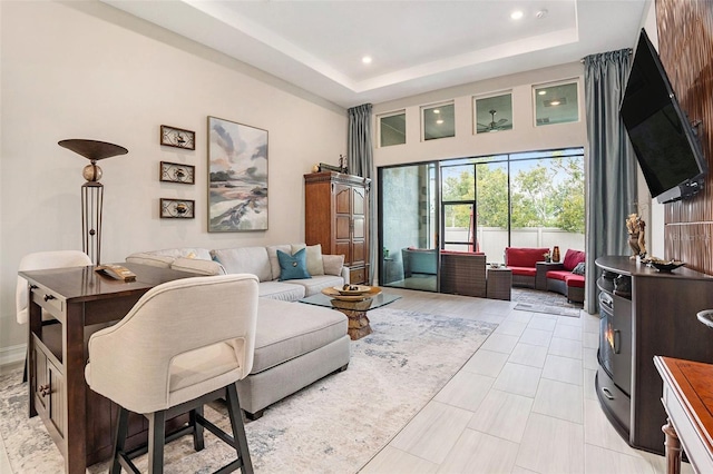 4329 Barletta Ct, Wesley Chapel, FL 33543 - living area with a raised ceiling, recessed lighting, and a towering ceiling