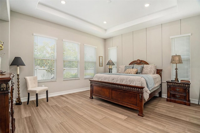 4329 Barletta Ct, Wesley Chapel, FL 33543 - bedroom with a raised ceiling, light wood finished floors, and recessed lighting