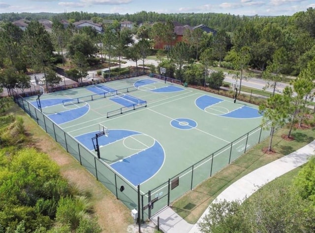 4329 Barletta Ct, Wesley Chapel, FL 33543 - view of sport court featuring community basketball court and a forest view