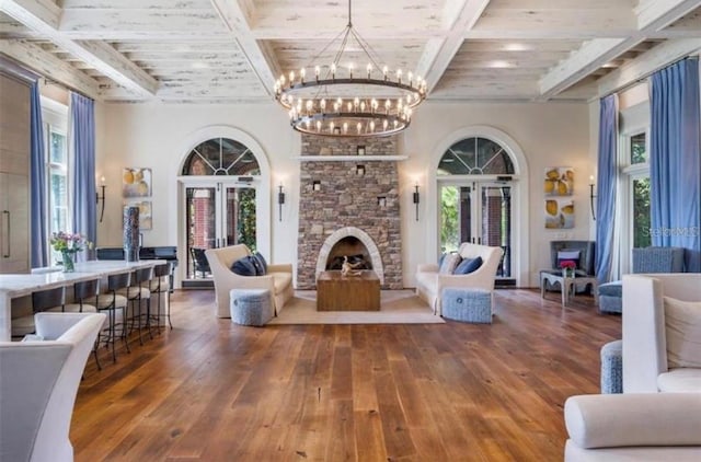 4329 Barletta Ct, Wesley Chapel, FL 33543 - living room with hardwood / wood-style flooring, beamed ceiling, a chandelier, healthy amount of natural light, and coffered ceiling