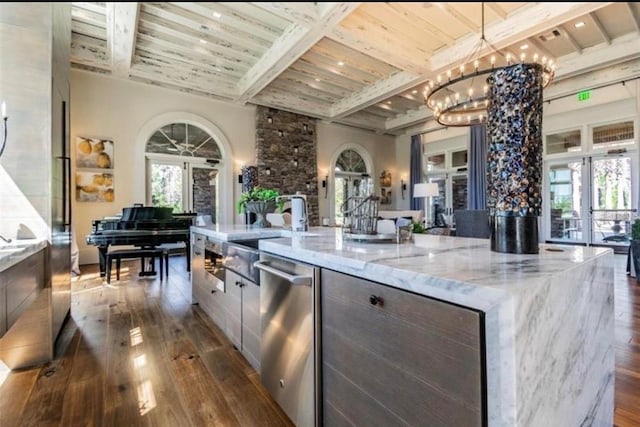 4329 Barletta Ct, Wesley Chapel, FL 33543 - kitchen featuring dark wood finished floors, modern cabinets, a chandelier, a large island, and dishwasher
