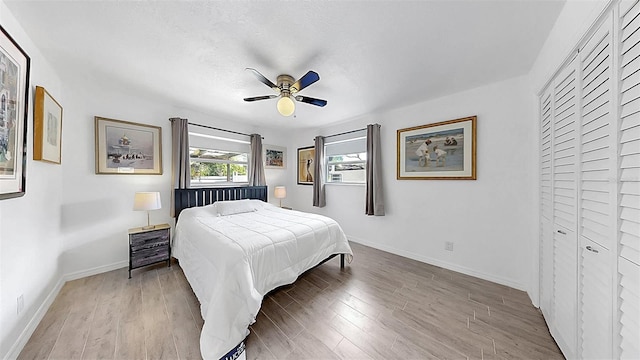 4735 W Oklahoma Ave, Tampa, FL 33616 - bedroom featuring baseboards, wood finished floors, and ceiling fan