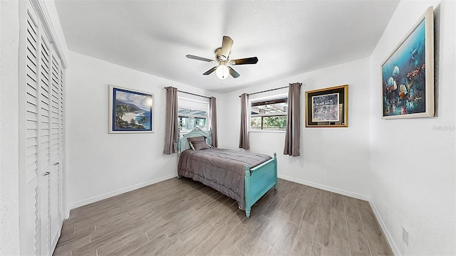 4735 W Oklahoma Ave, Tampa, FL 33616 - bedroom featuring light wood-style flooring, baseboards, and a ceiling fan