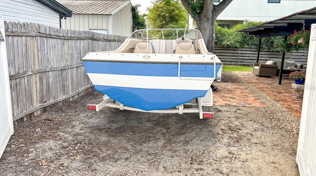 4735 W Oklahoma Ave, Tampa, FL 33616 - fenced backyard featuring outdoor lounge area and a patio
