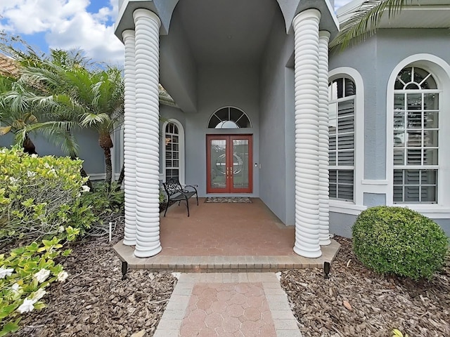 16343 Burniston Dr, Tampa, FL 33647 - view of exterior entry with french doors and stucco siding