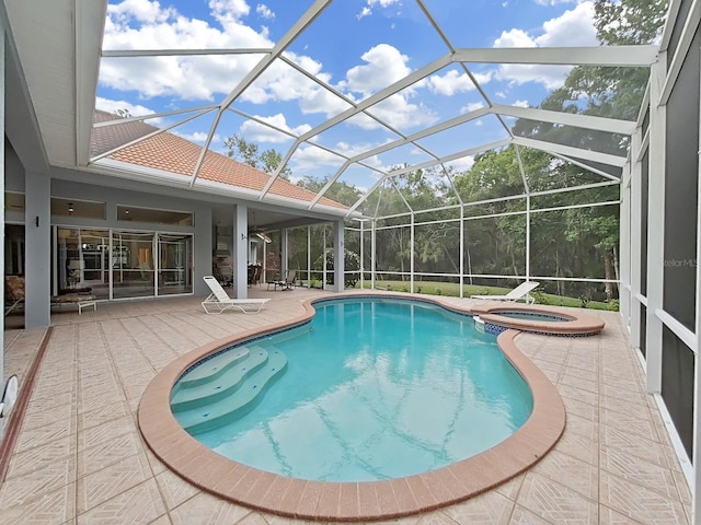 16343 Burniston Dr, Tampa, FL 33647 - view of swimming pool featuring a patio area, a pool with connected hot tub, and glass enclosure
