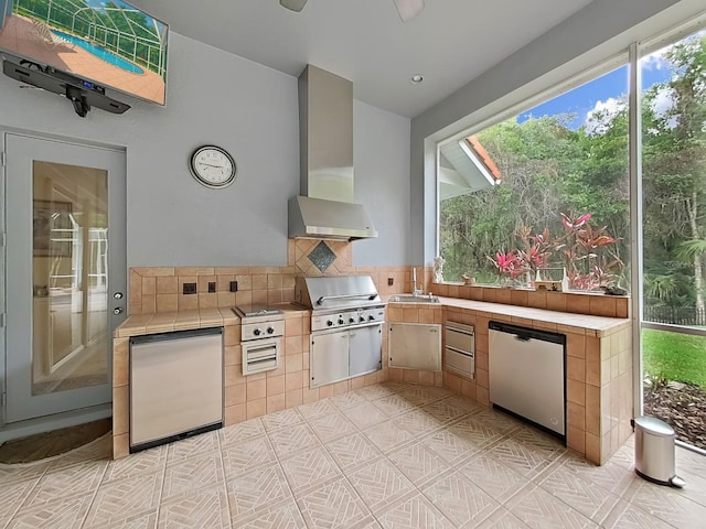 16343 Burniston Dr, Tampa, FL 33647 - kitchen with tile counters, fridge, and a sink