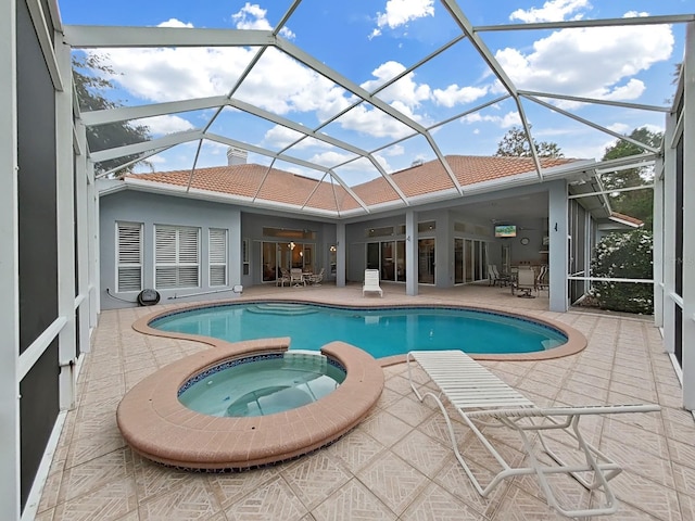 16343 Burniston Dr, Tampa, FL 33647 - view of swimming pool with a patio area, a pool with connected hot tub, and glass enclosure