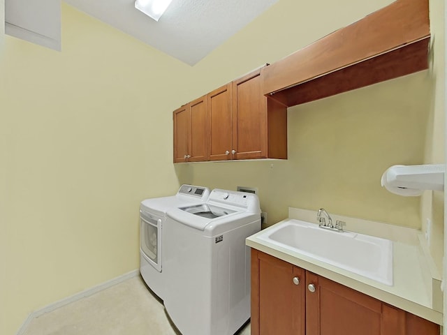 16343 Burniston Dr, Tampa, FL 33647 - laundry area with cabinet space, washer and dryer, and baseboards