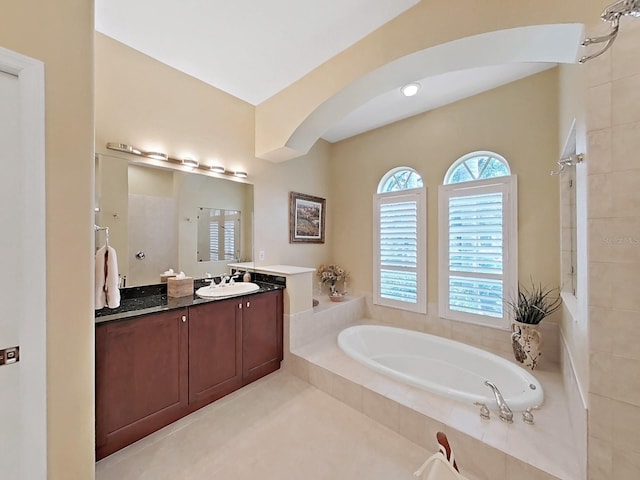 16343 Burniston Dr, Tampa, FL 33647 - full bathroom with a bath, vanity, and tiled shower