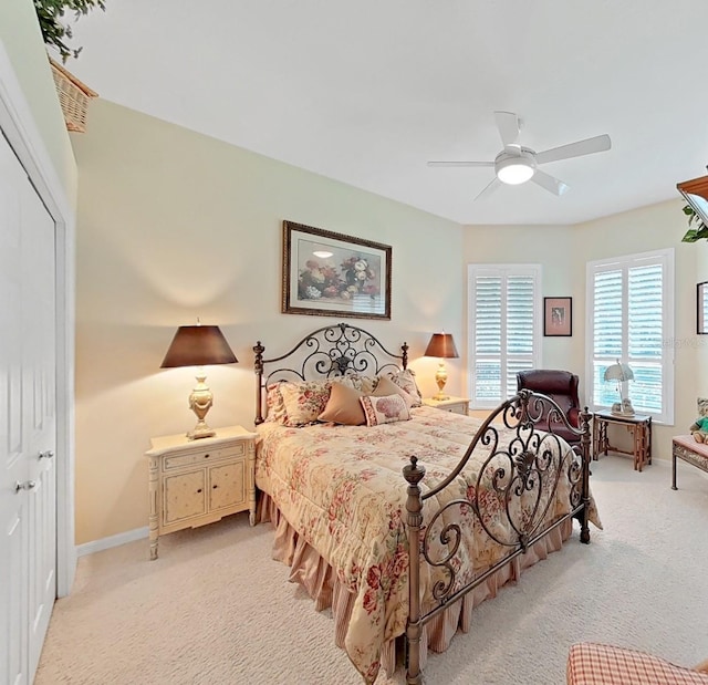 16343 Burniston Dr, Tampa, FL 33647 - bedroom with light carpet, a closet, baseboards, and ceiling fan