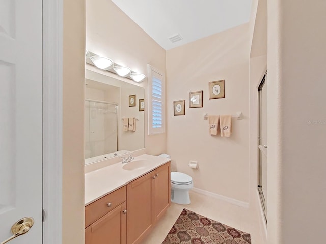 16343 Burniston Dr, Tampa, FL 33647 - full bathroom with a shower with shower door, toilet, vanity, and tile patterned floors