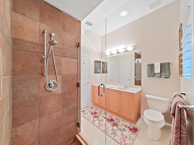 16343 Burniston Dr, Tampa, FL 33647 - full bath featuring tiled shower, toilet, vanity, and tile patterned floors