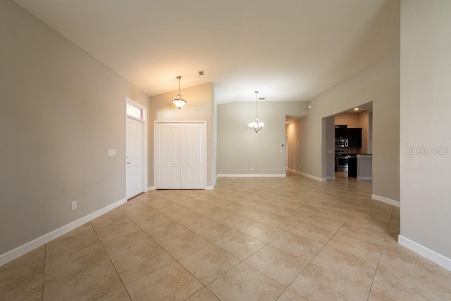 12352 Crestridge Loop, New Port Richey, FL 34655 - unfurnished room with vaulted ceiling, a chandelier, light tile patterned flooring, and baseboards